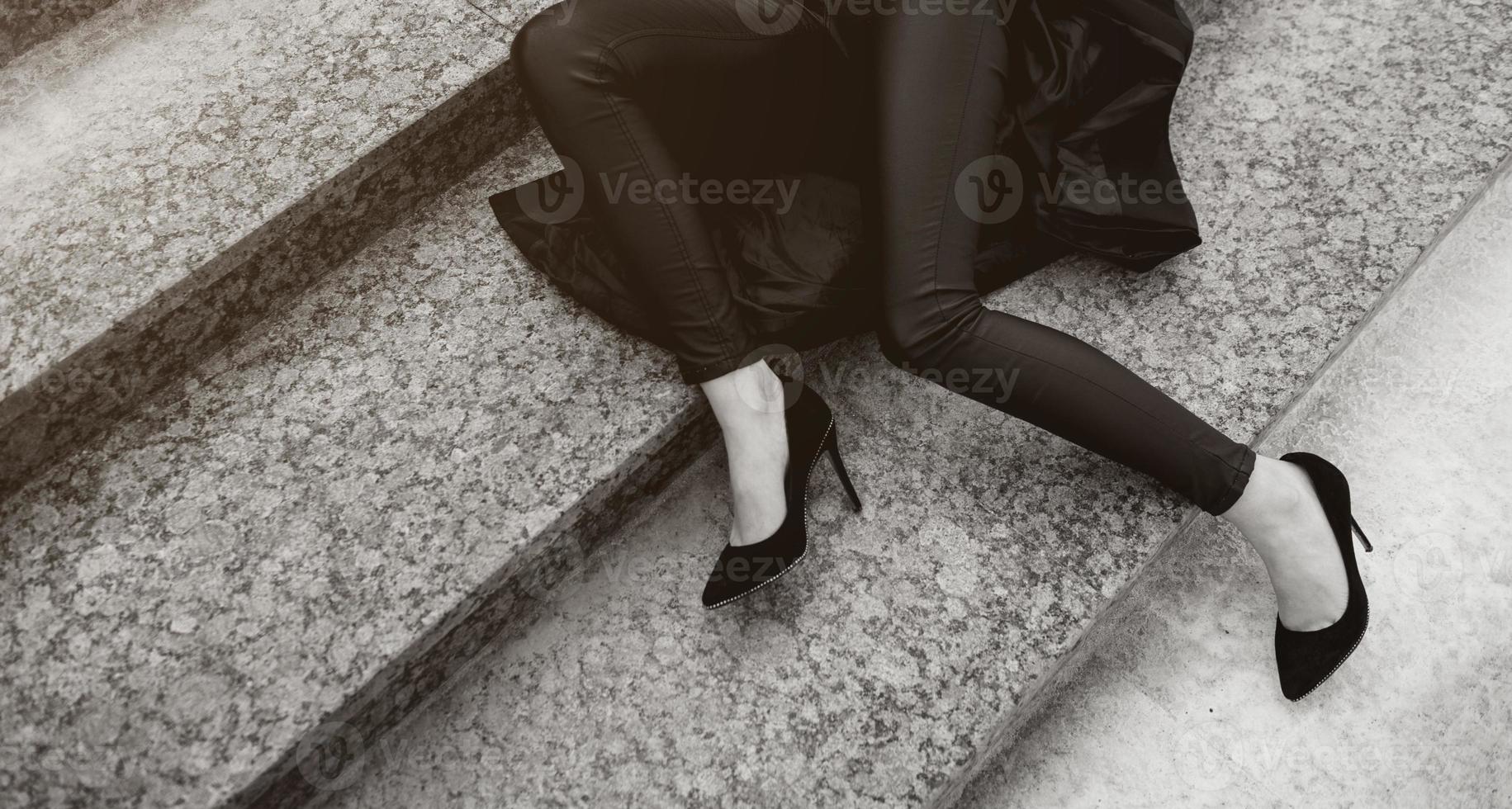 legs with black high-heeled shoes photo