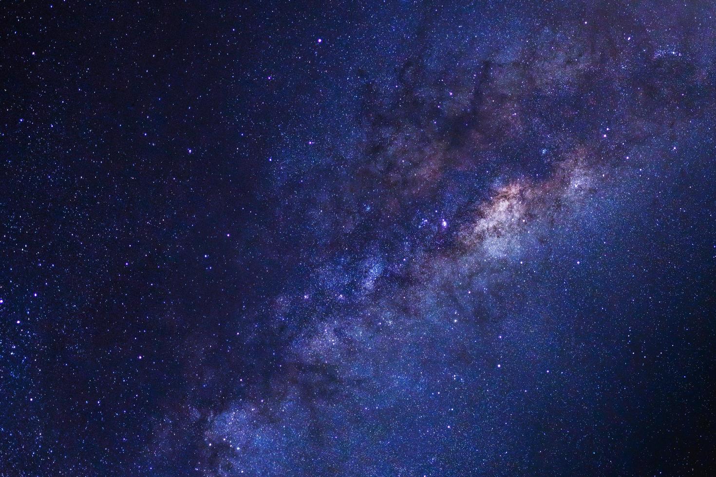 Starry night sky, Milky way galaxy with stars and space dust in the universe, Long exposure photograph, with grain. photo