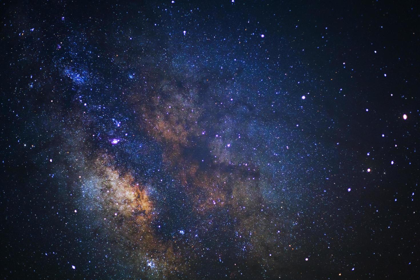 Close up of Milky way galaxy with stars and space dust in the universe, Long exposure photograph, with grain. photo