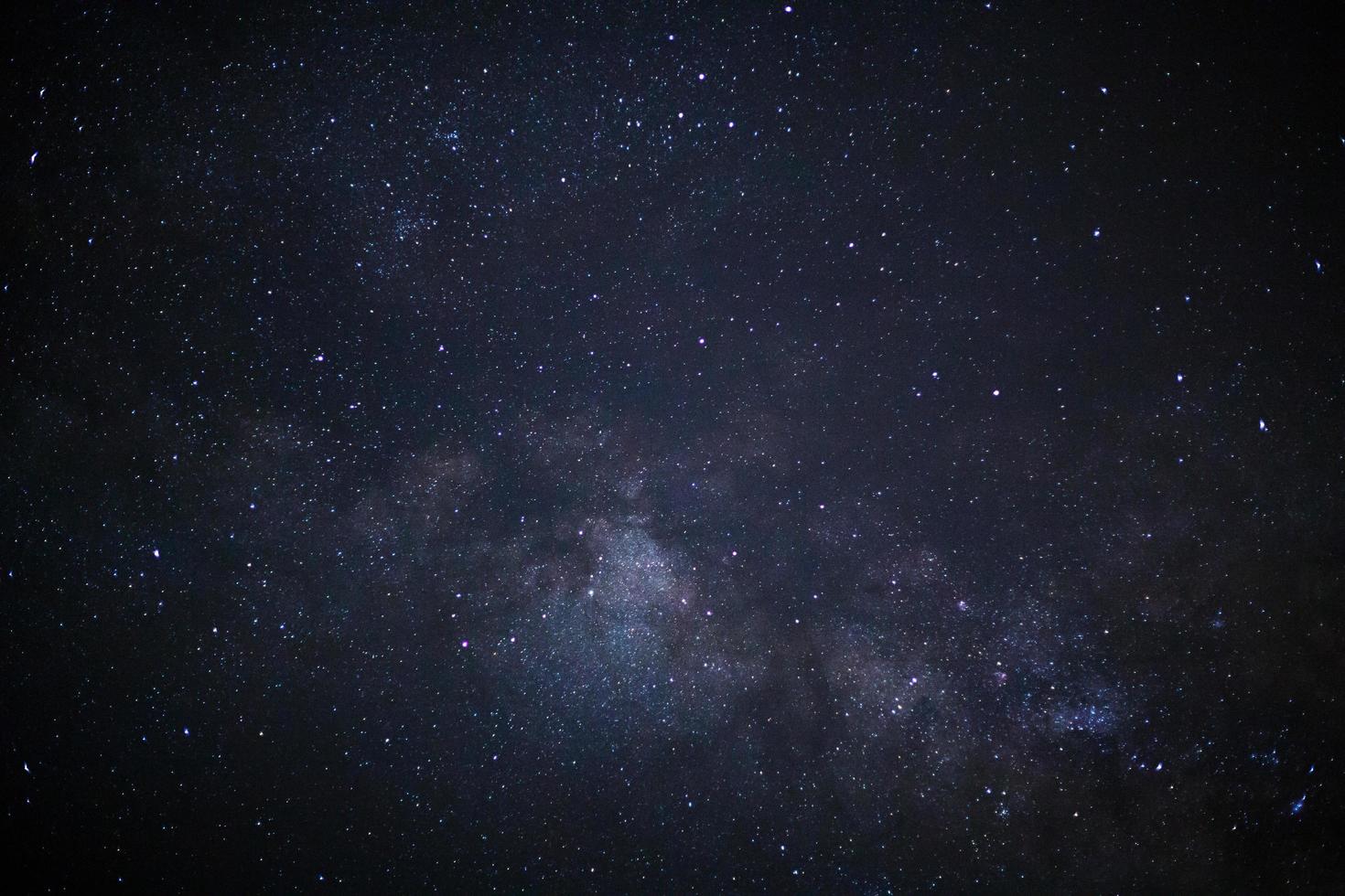 Milky way galaxy with stars and space dust in the universe, Long exposure photograph, with grain. photo