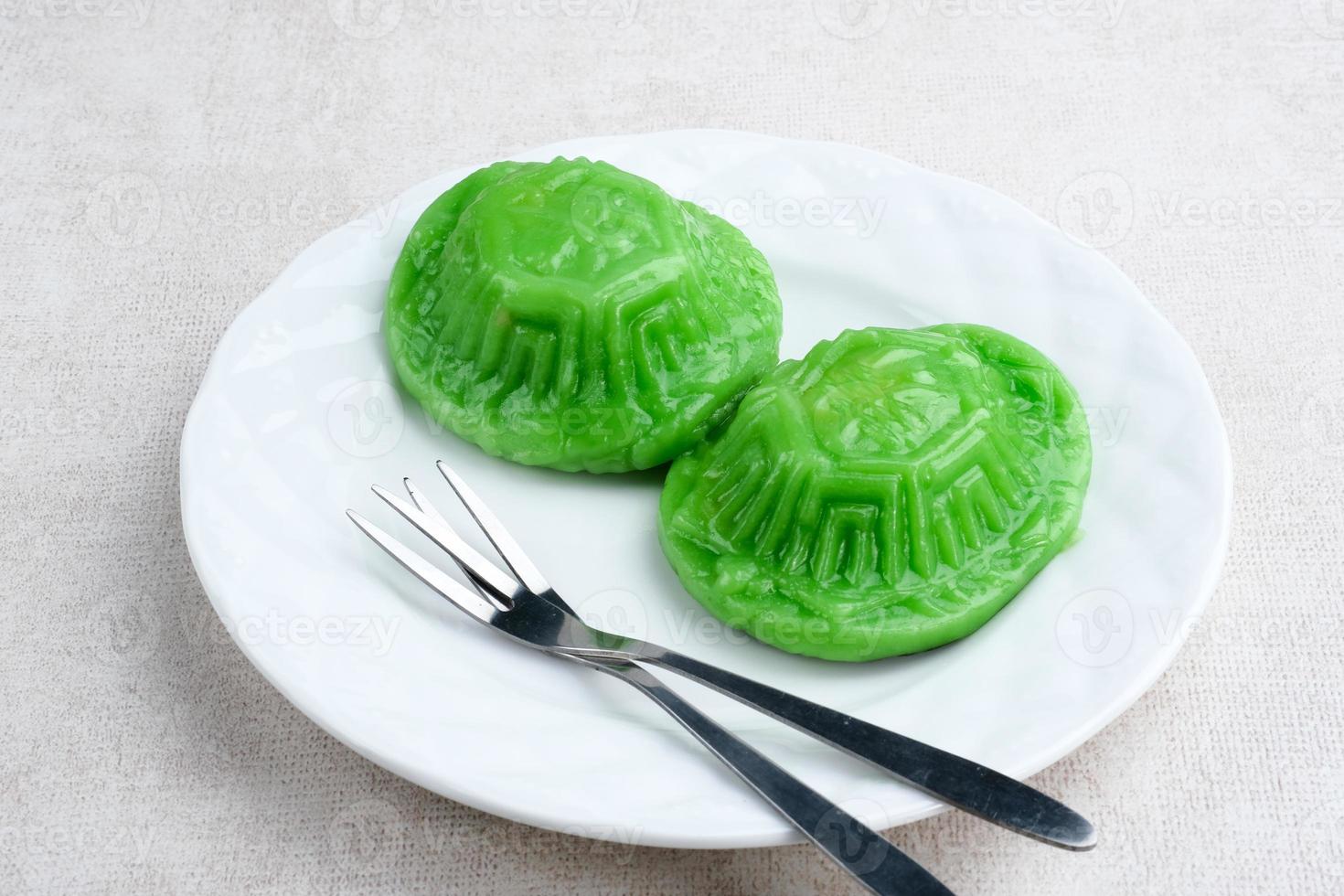 Ang Kue, Kue Ku or Kue Thok, steamed Chinese pastry of glutinous rice flour with sweet mung bean paste filling. Sticky, chewy texture. photo