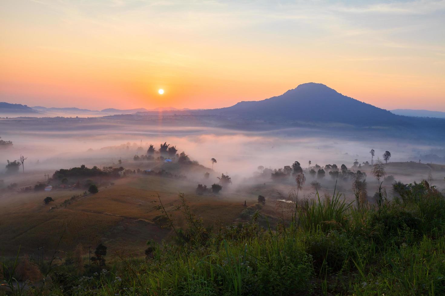 Misty morning sunrise in Khao Takhian Ngo View Point at Khao-kho Phetchabun,Thailand photo