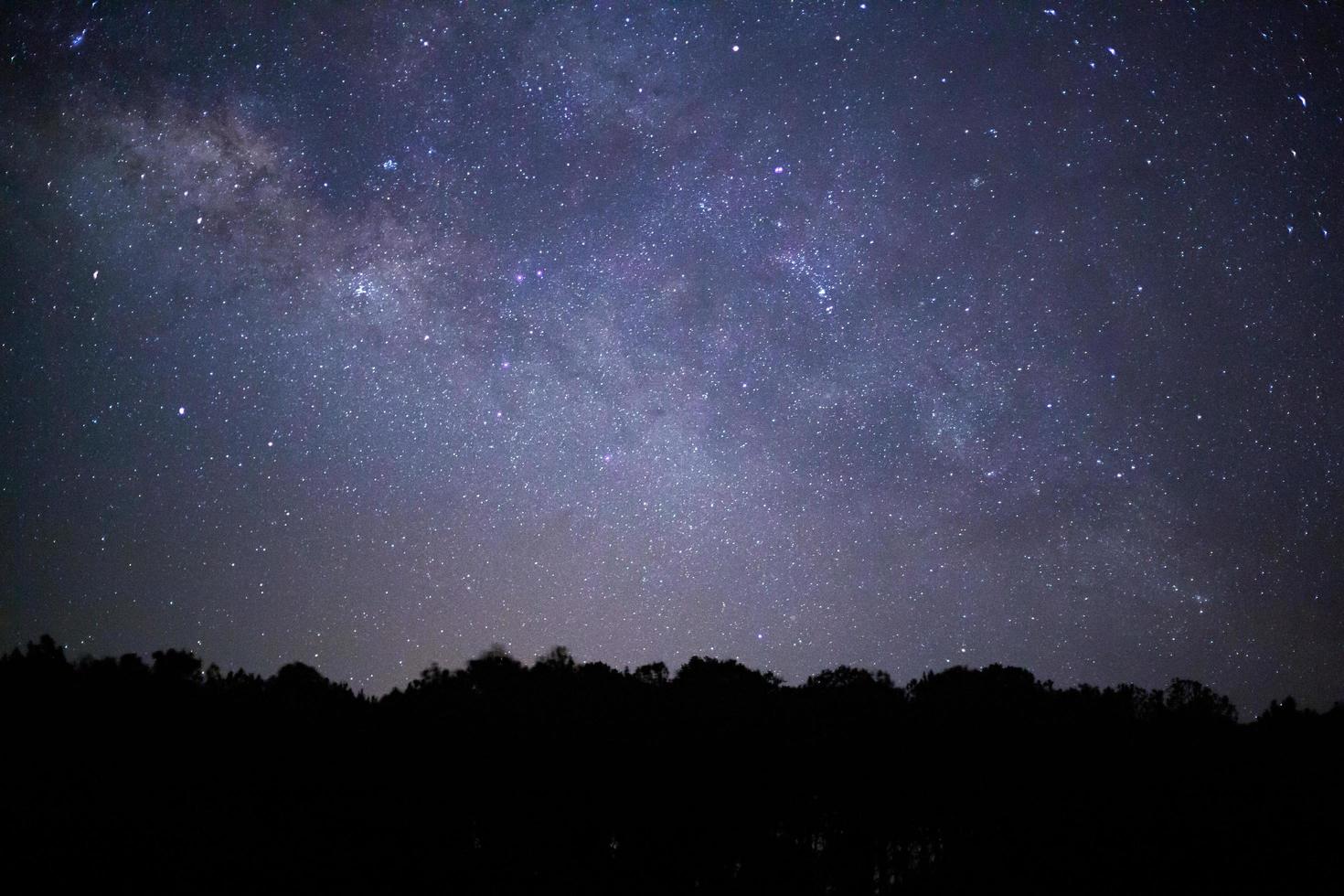 milky way galaxy and space dust in the universe, Long exposure photograph, with grain. photo