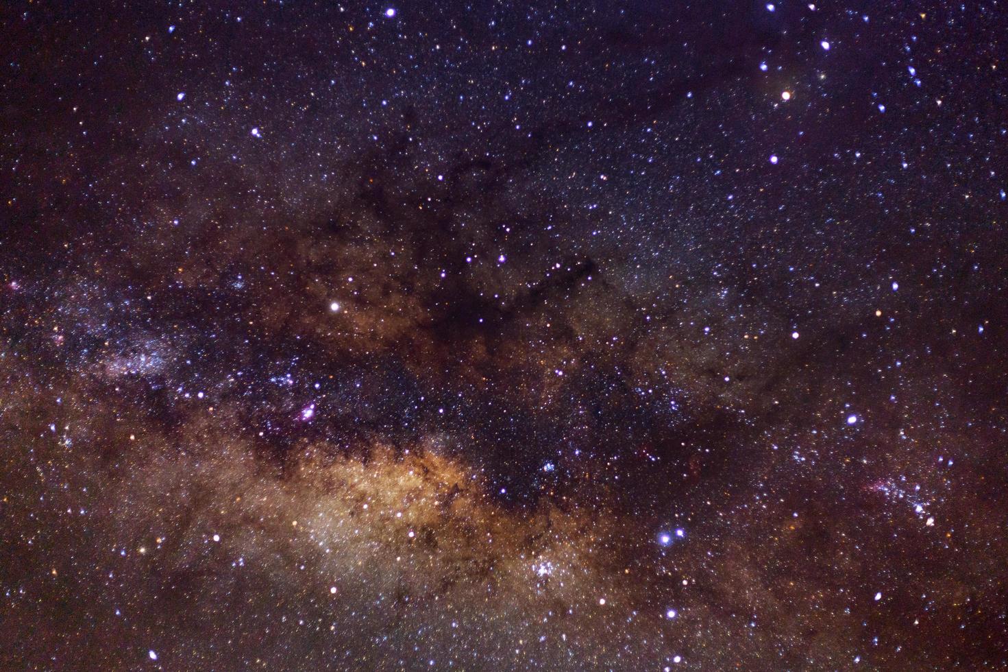 Starry night sky, Milky way galaxy with stars and space dust in the universe, Long exposure photograph, with grain. photo