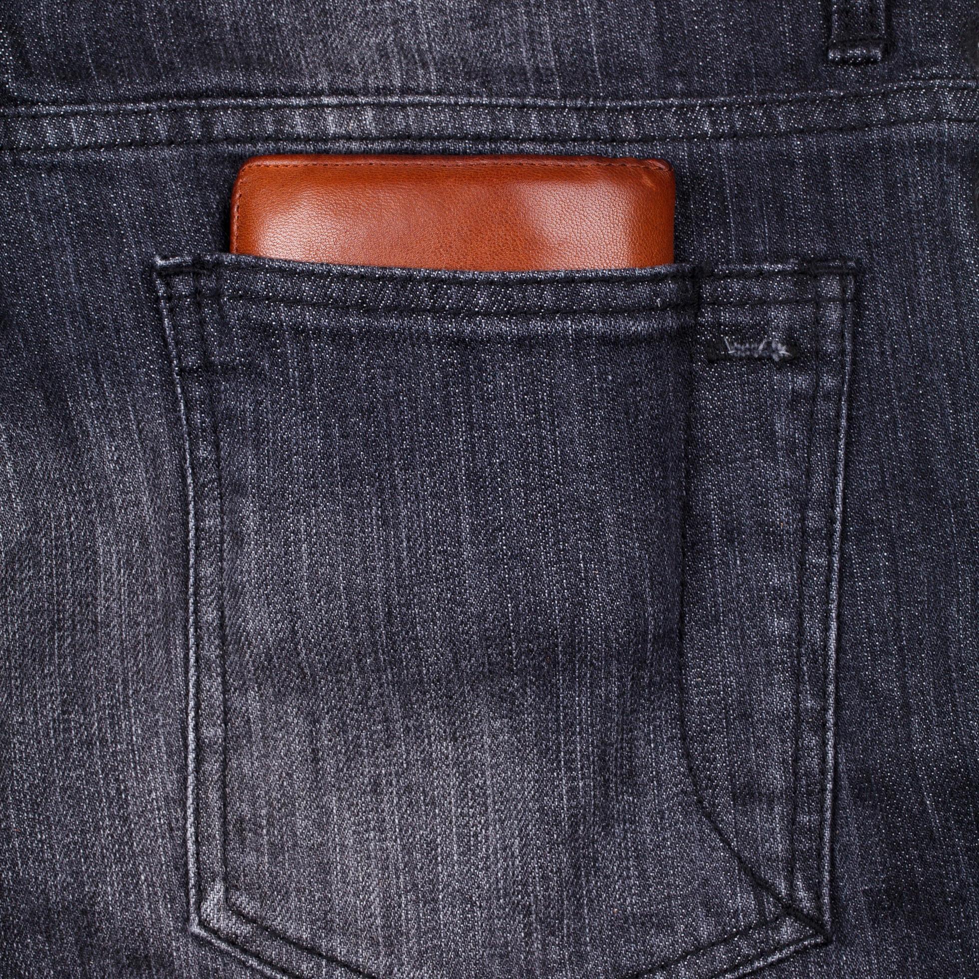 Wallet in jeans back pocket 9806202 Stock Photo at Vecteezy