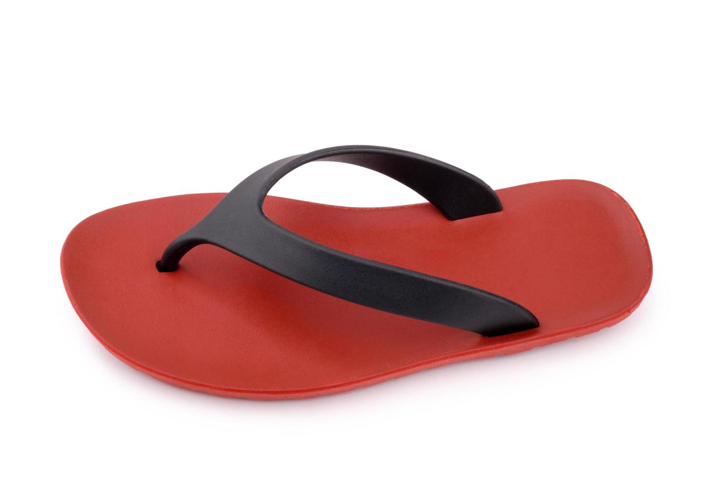 Red rubber flip flops on a white background photo
