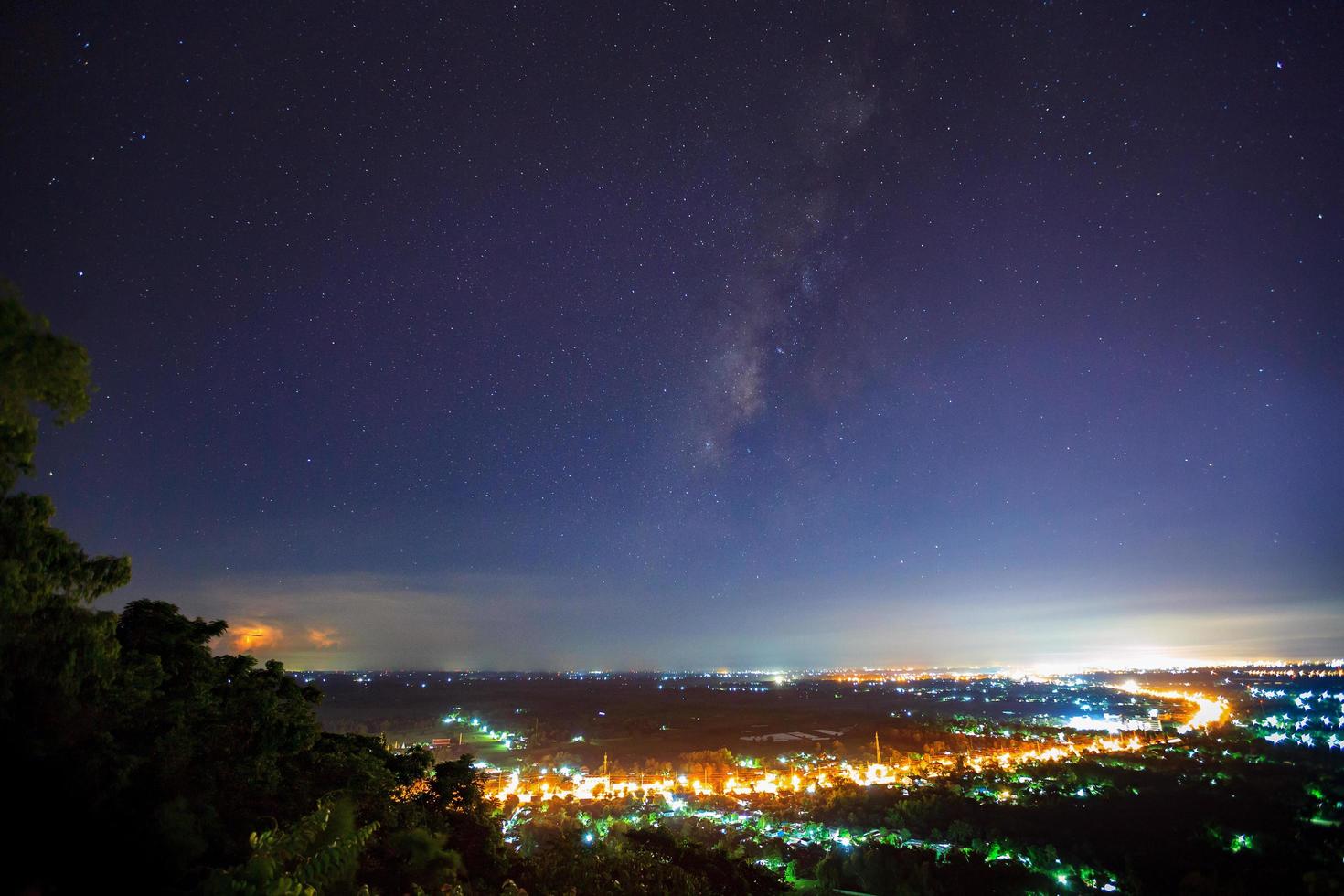 City landscape at nigh with Milky Way galaxy, Long exposure photograph photo