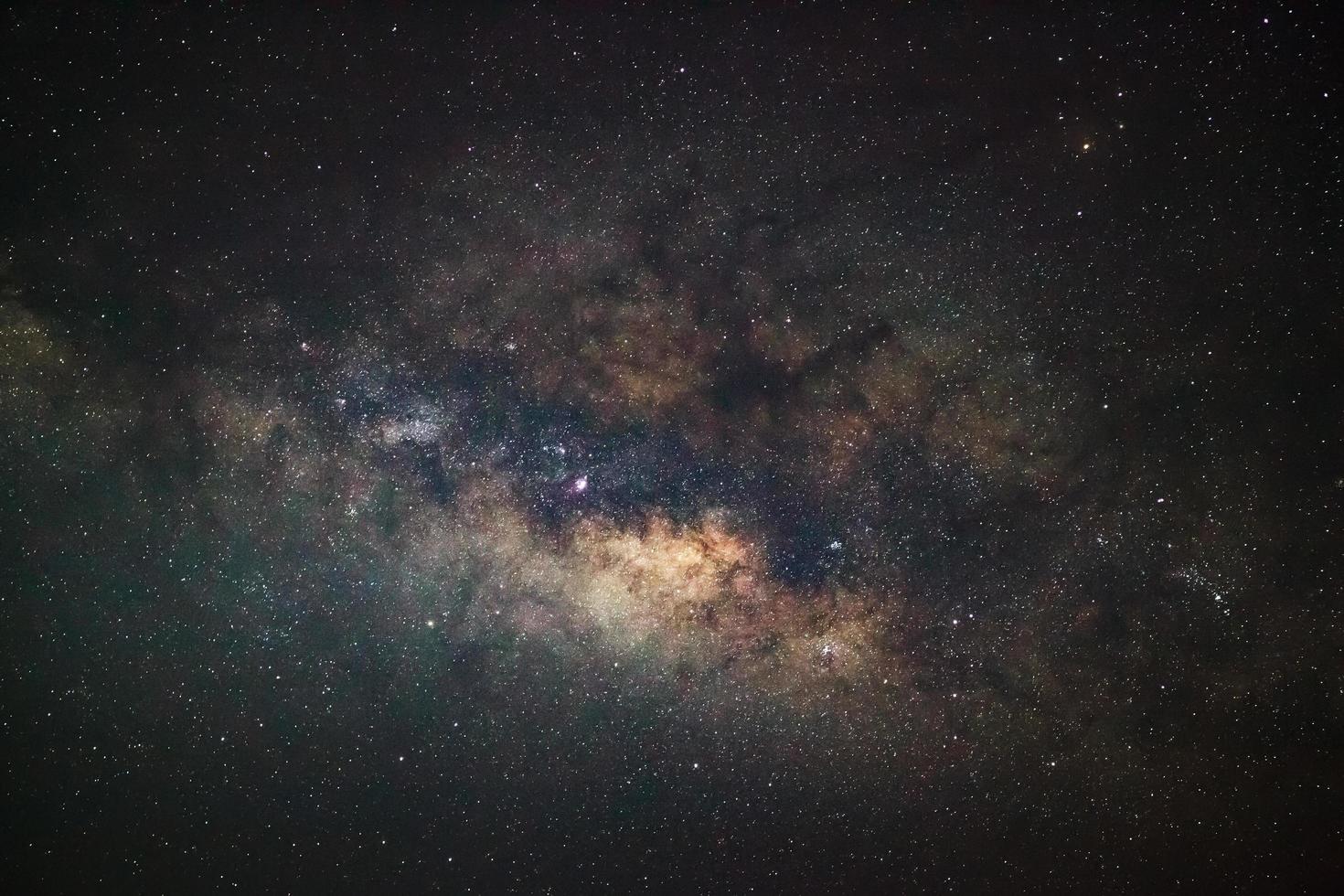 Milky Way galaxy, Long exposure photograph, with grain. photo