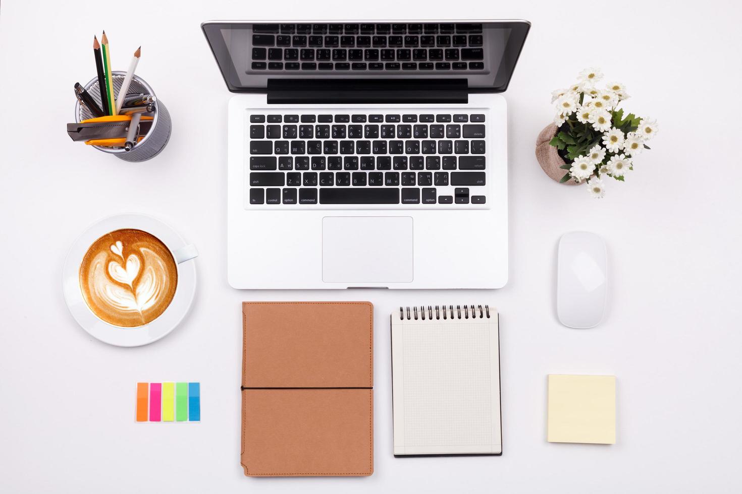 Top view laptop or notebook workspace office on white table photo