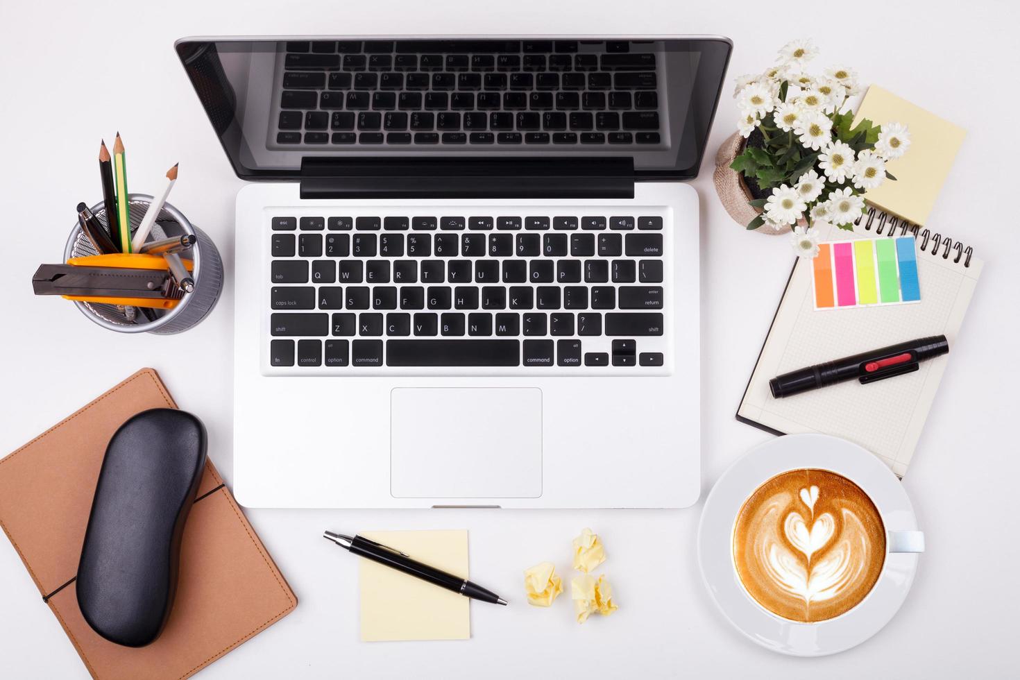 Top view laptop or notebook workspace office on white table photo