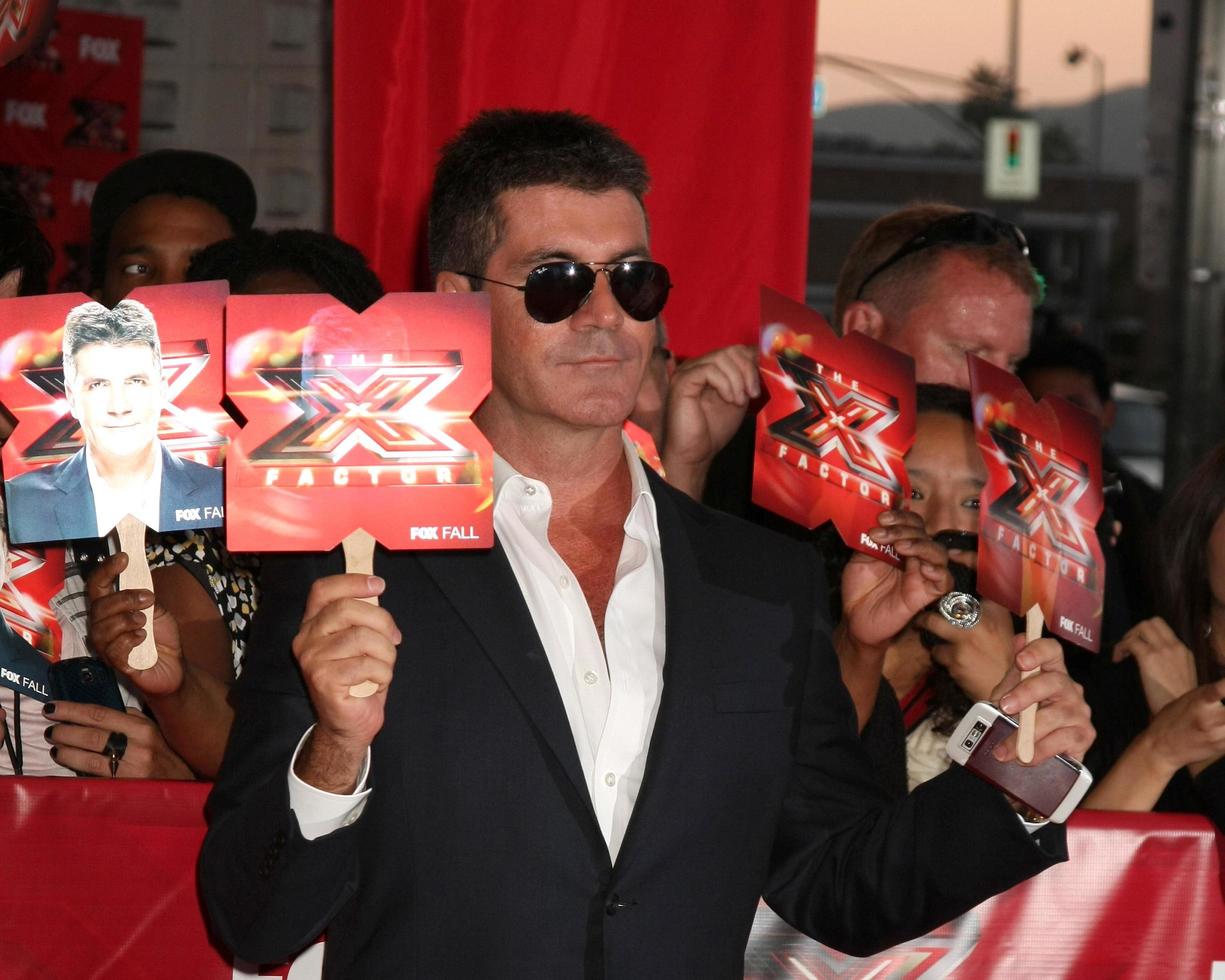 LOS ANGELES, SEP 14 - Simon Cowell arriving at the X-Factor Premiere Screening at ArcLight Theater on September 14, 2011 in Los Angeles, CA photo