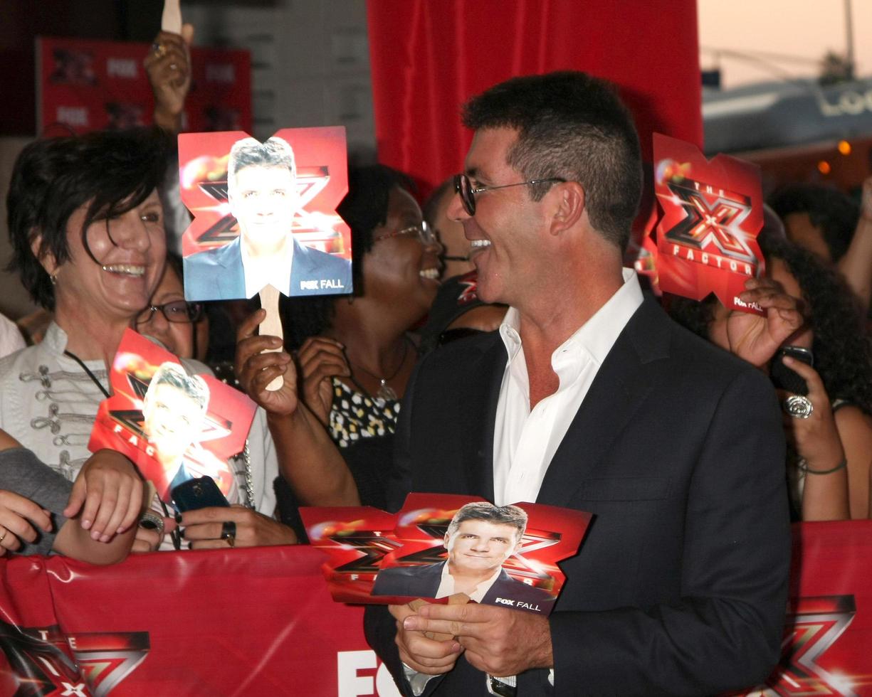 LOS ANGELES, SEP 14 - Simon Cowell arriving at the X-Factor Premiere Screening at ArcLight Theater on September 14, 2011 in Los Angeles, CA photo