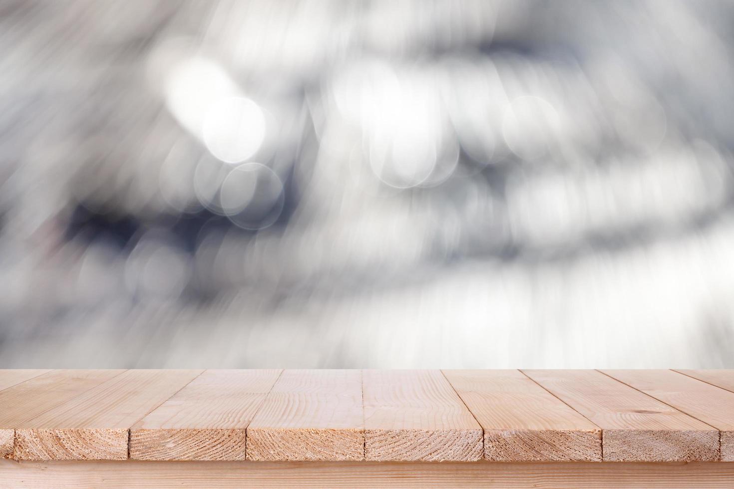 brown wood table top on bokeh abstract white background - can be used for montage or display your products photo