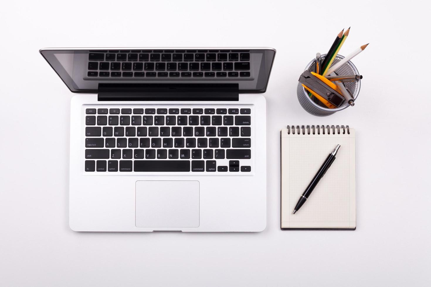 Top view laptop or notebook workspace office on white table photo