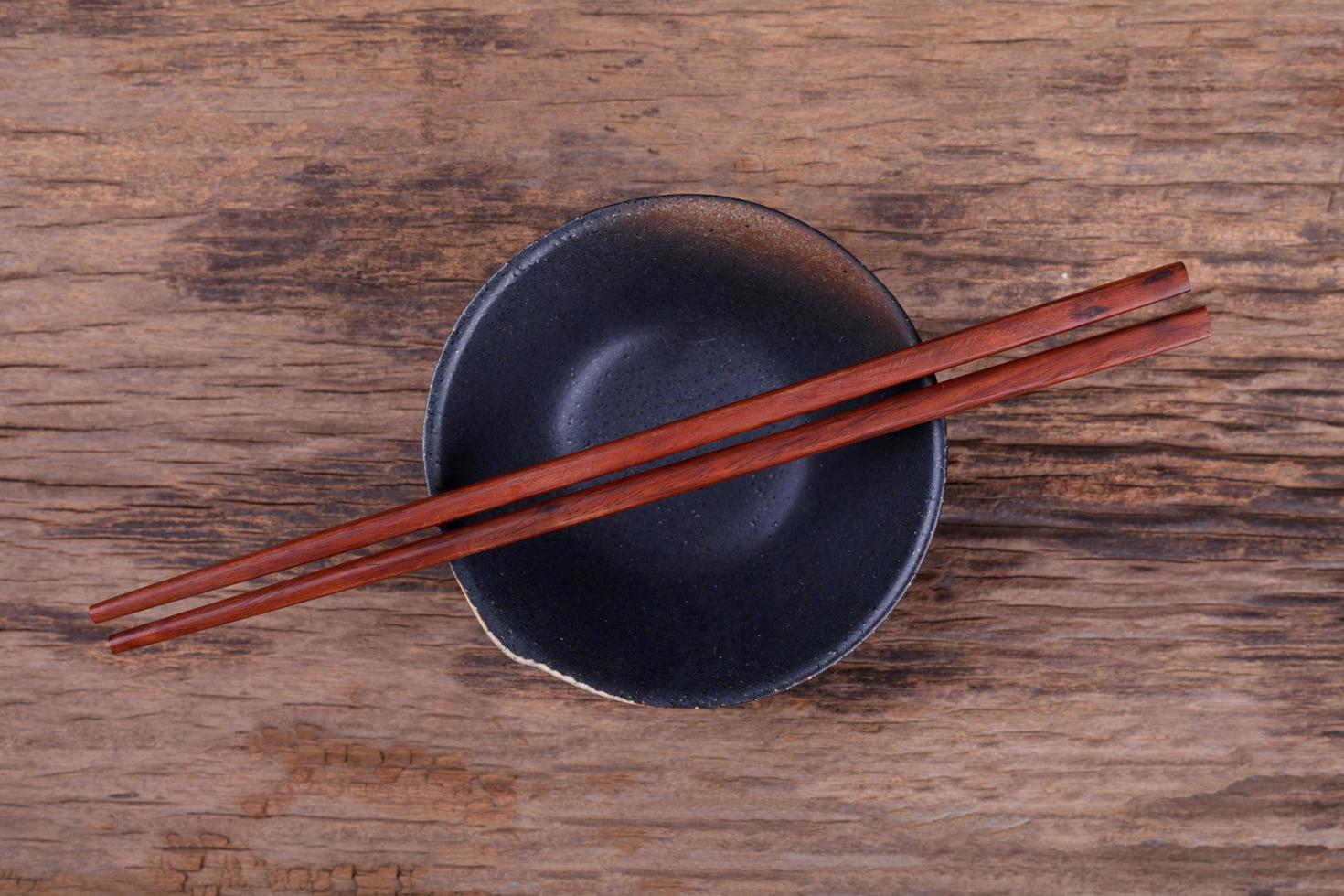 Chopsticks and black bowl photo