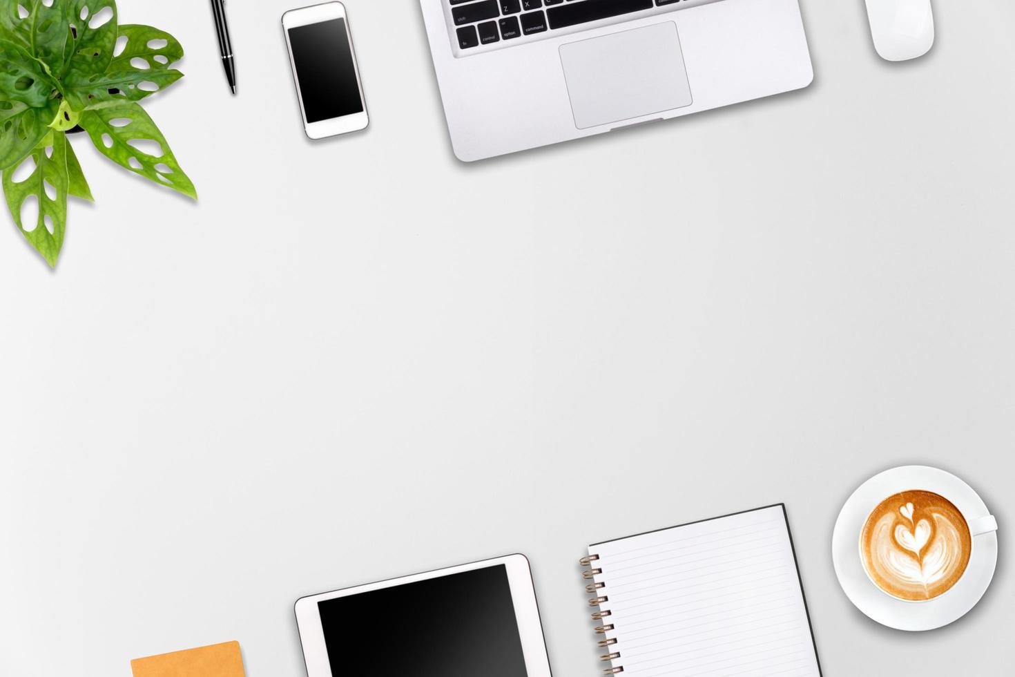 Modern workspace with laptop tablet, smartphone and coffee cup copy space on wood background. Top view. Flat lay style. photo