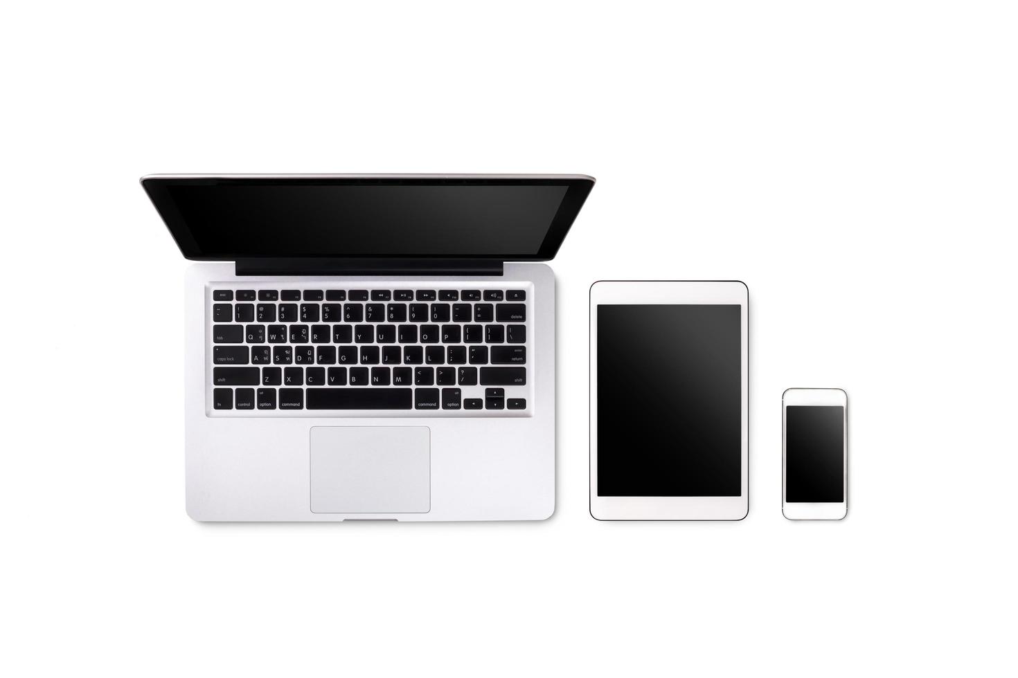 Laptop tablet and smartphone on white background with text space and copy space photo