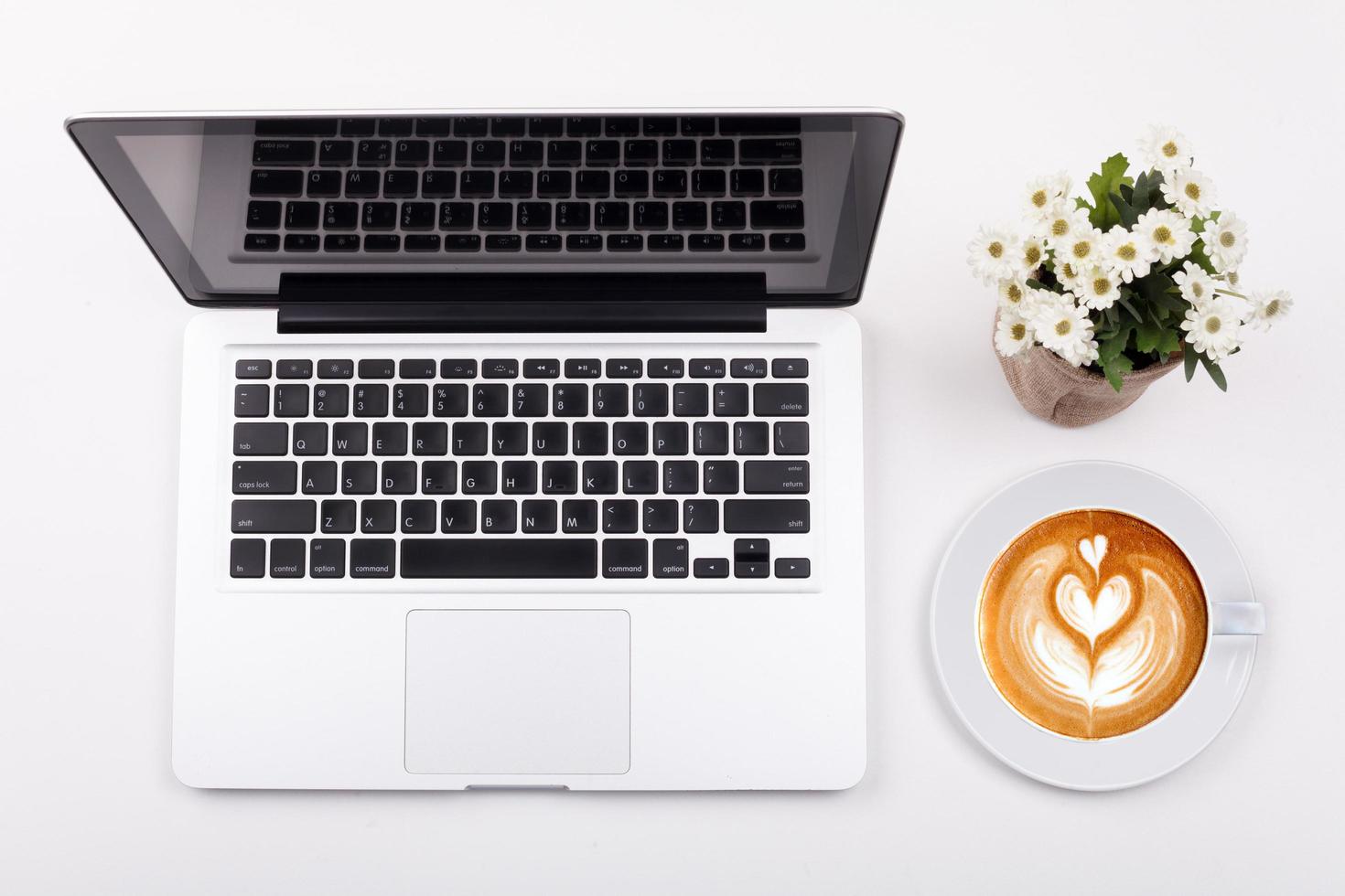 Top view laptop or notebook workspace office on white table photo