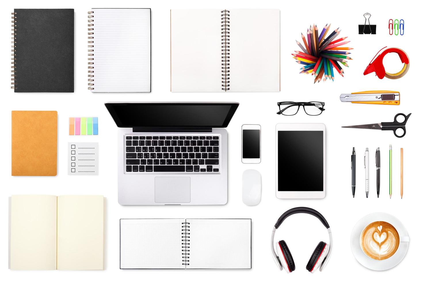 Businessman's desk with laptop, tablet smartphone and office supplies on white background photo