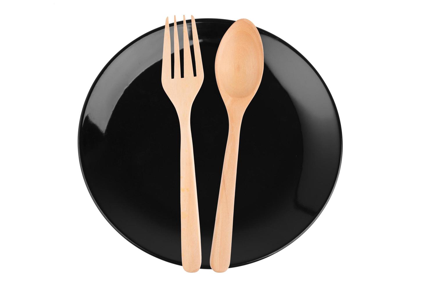 Empty black caramic celadon dish and spoon fork photo