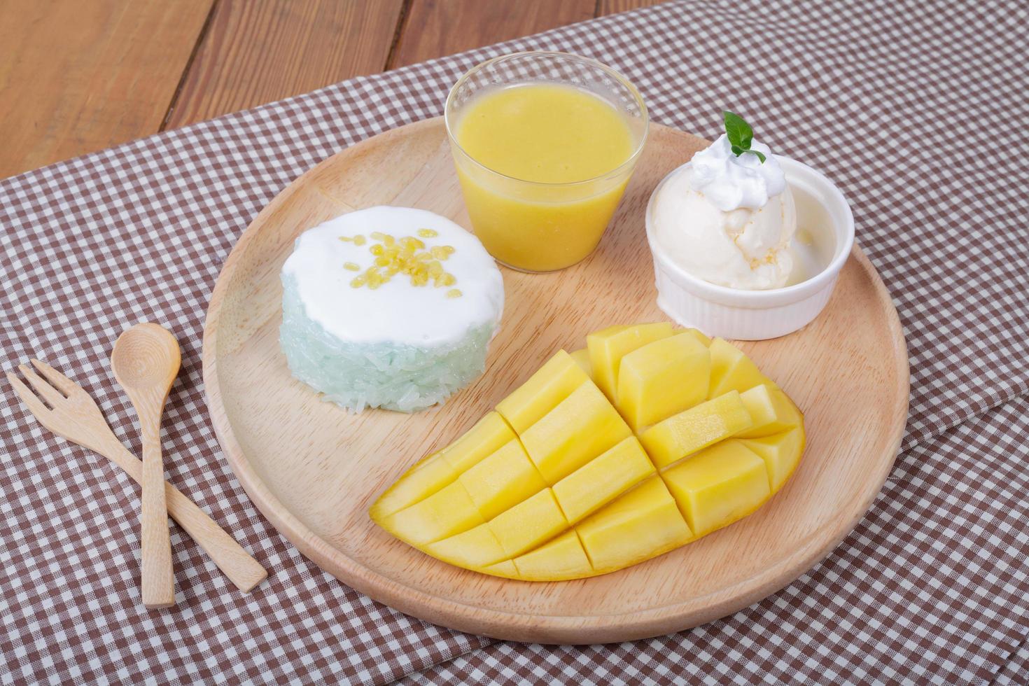 dessert sweet sticky rice with mango coconut milk photo