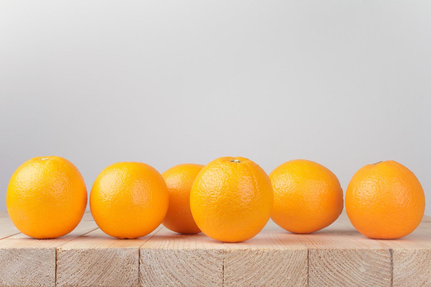 Fresh orange on wood table photo