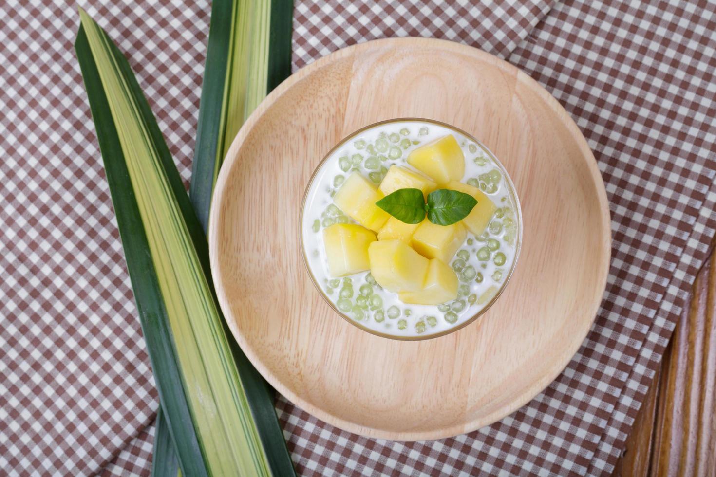 Thai dessert of tapioca pearls pudding with mango photo