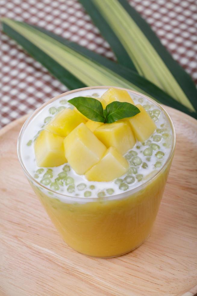 Thai dessert of tapioca pearls pudding with mango photo
