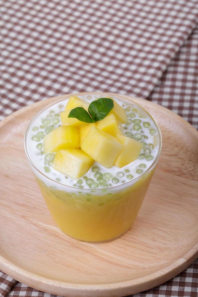 Thai dessert of tapioca pearls pudding with mango photo