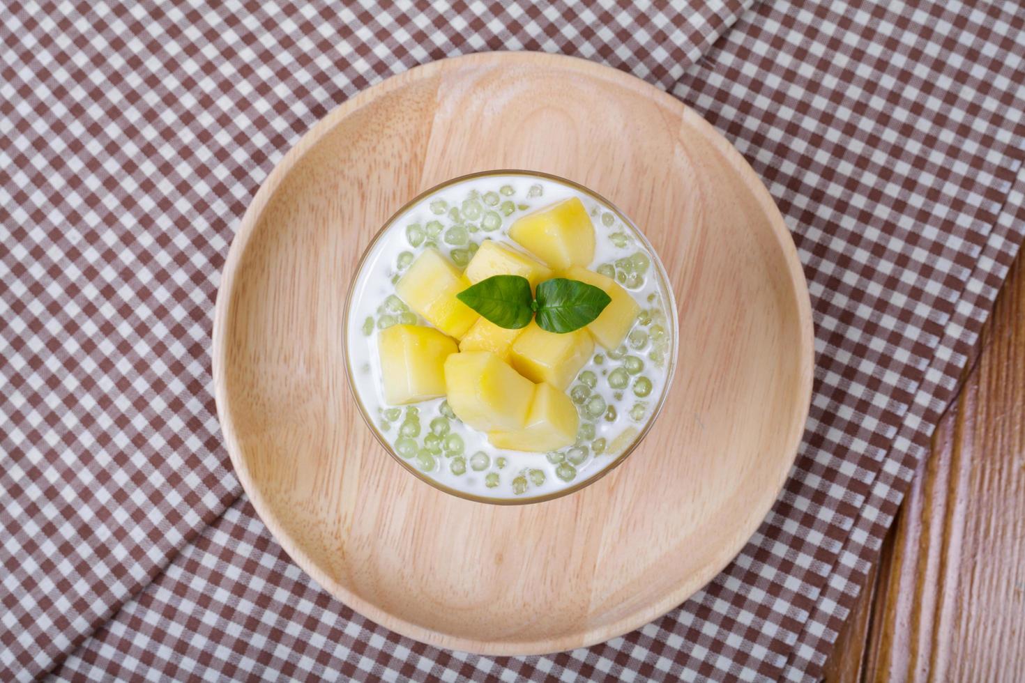 Thai dessert of tapioca pearls pudding with mango photo