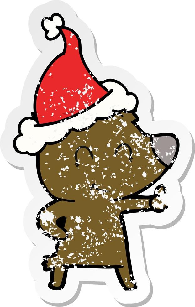 female bear distressed sticker cartoon of a wearing santa hat vector