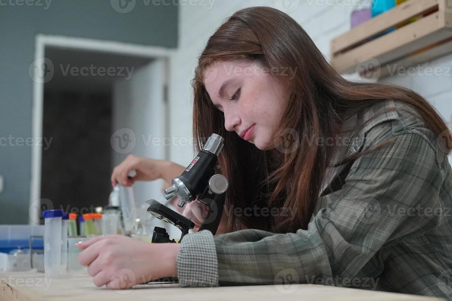 Student in classroom, young girl happy funny study and play with experimenting in class. photo