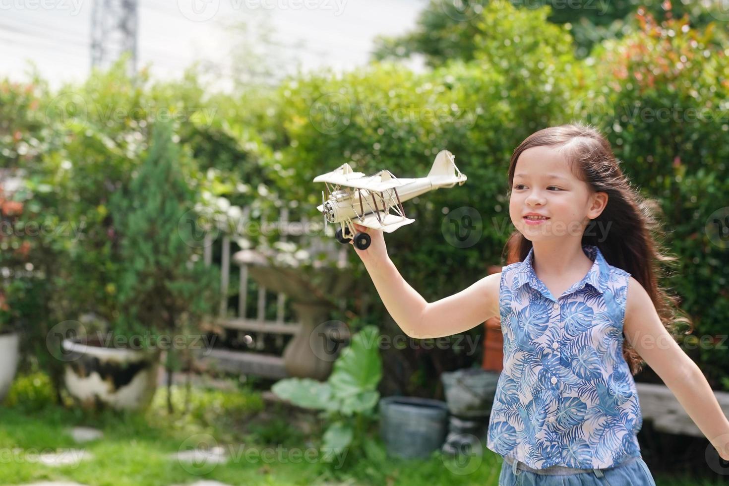 Child Play With Airplane outdoor - Imagination And Freedom Concept photo