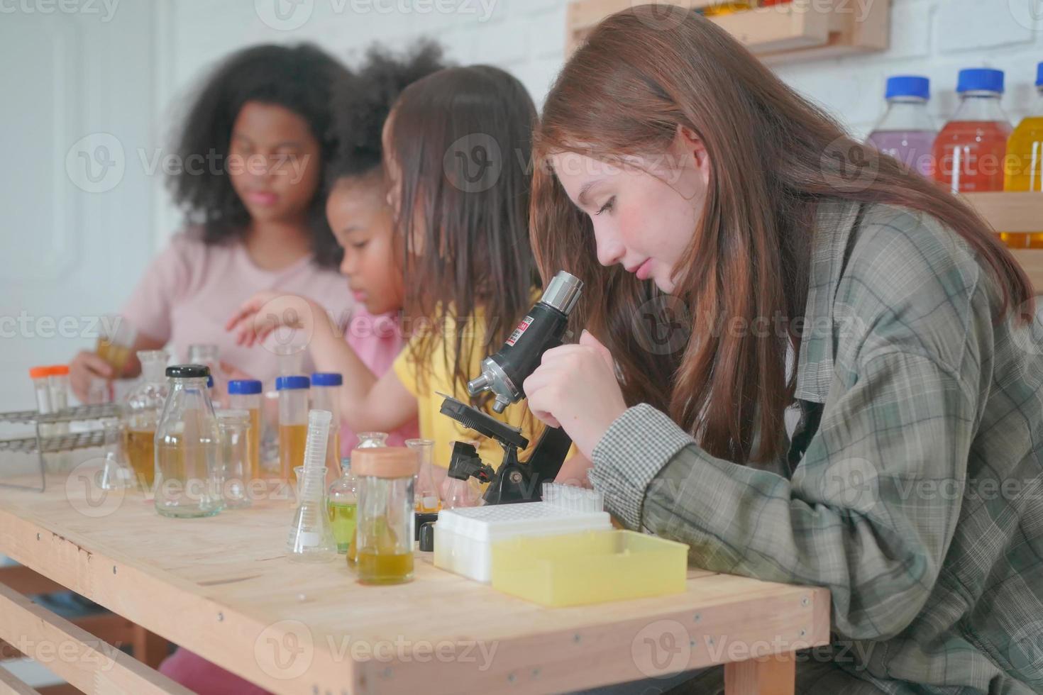 Student in classroom, young girl happy funny study and play with experimenting in class. photo