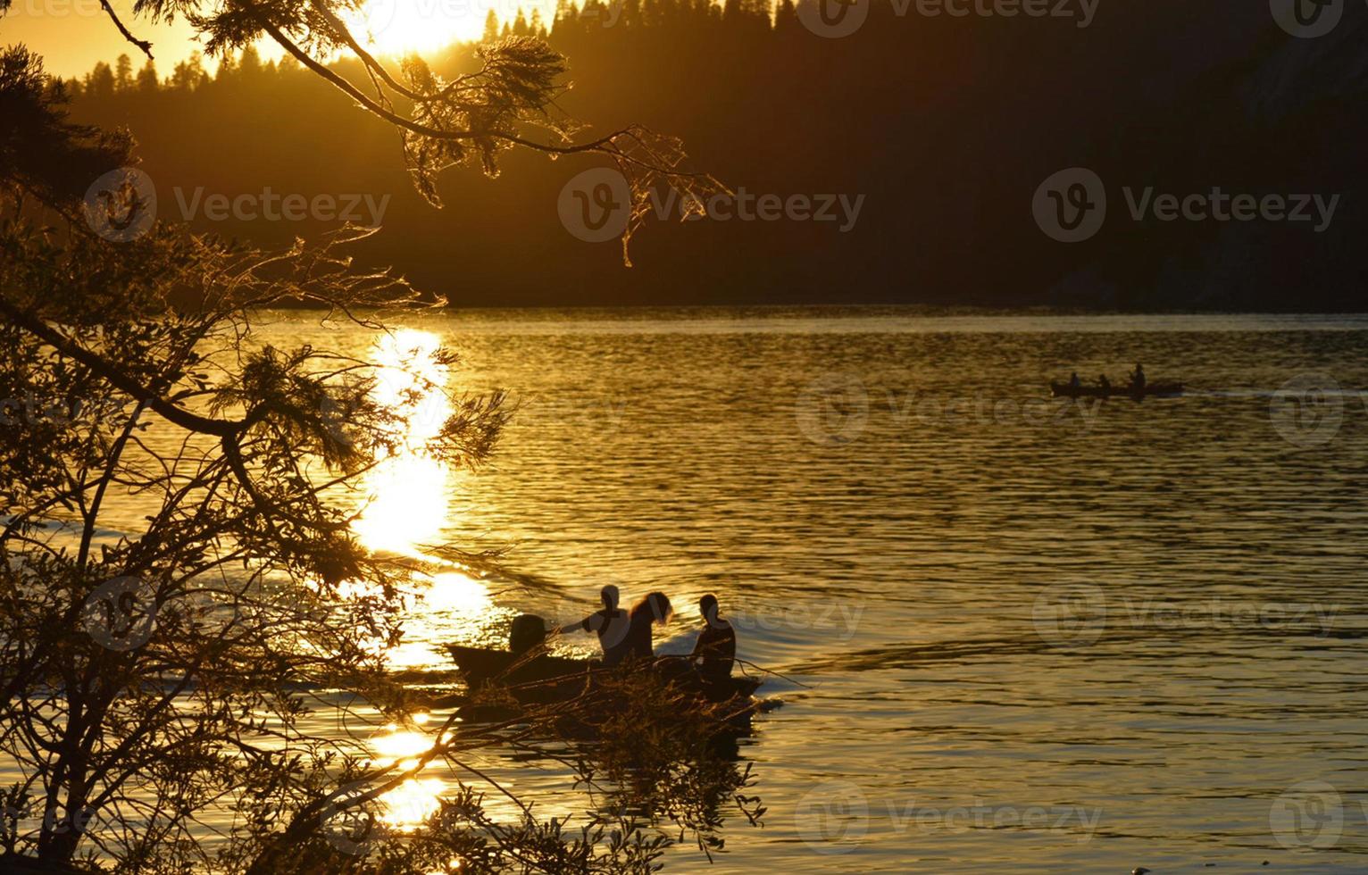 Kids in Boat at Sunset photo