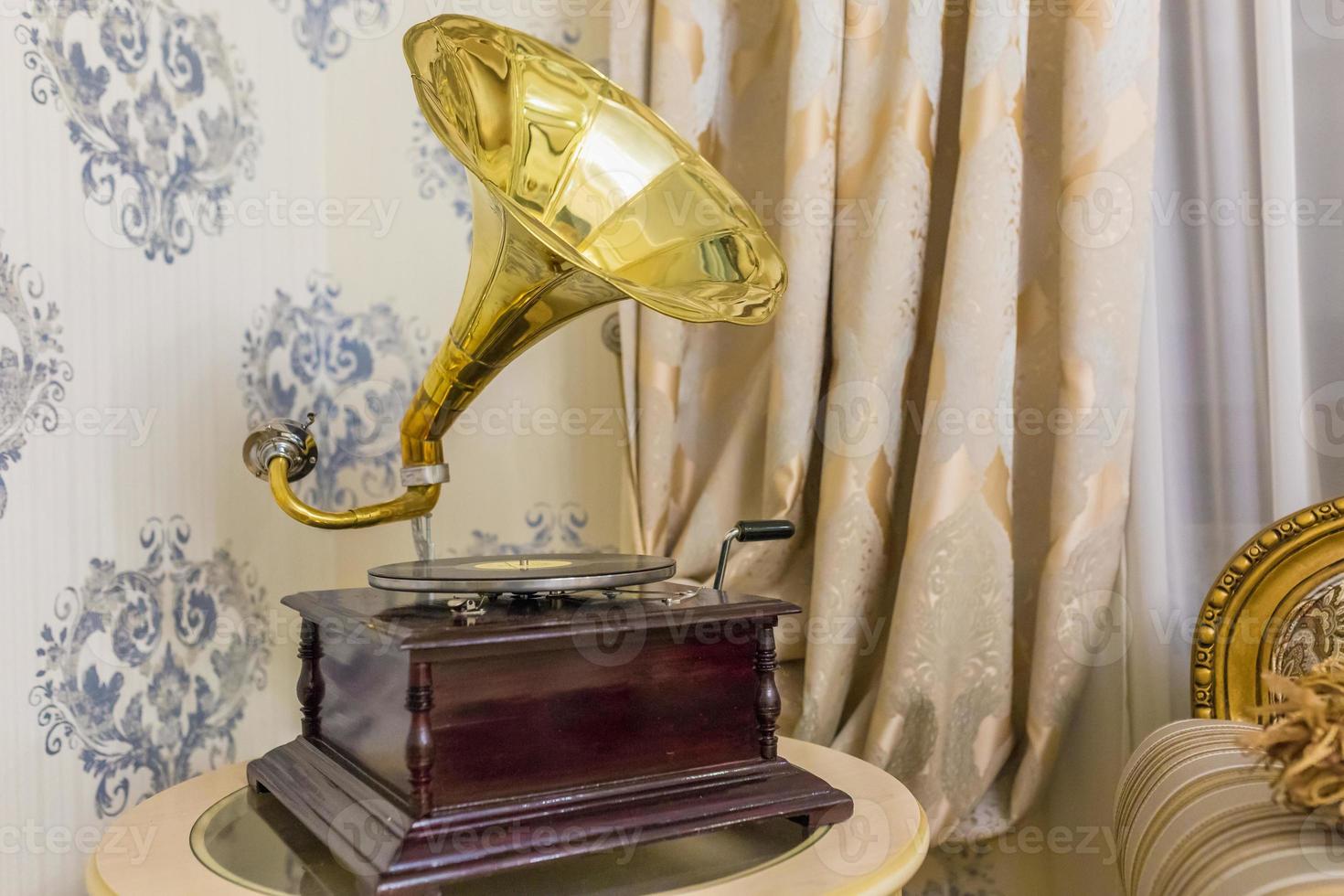 Old vintage gramophone in interior photo