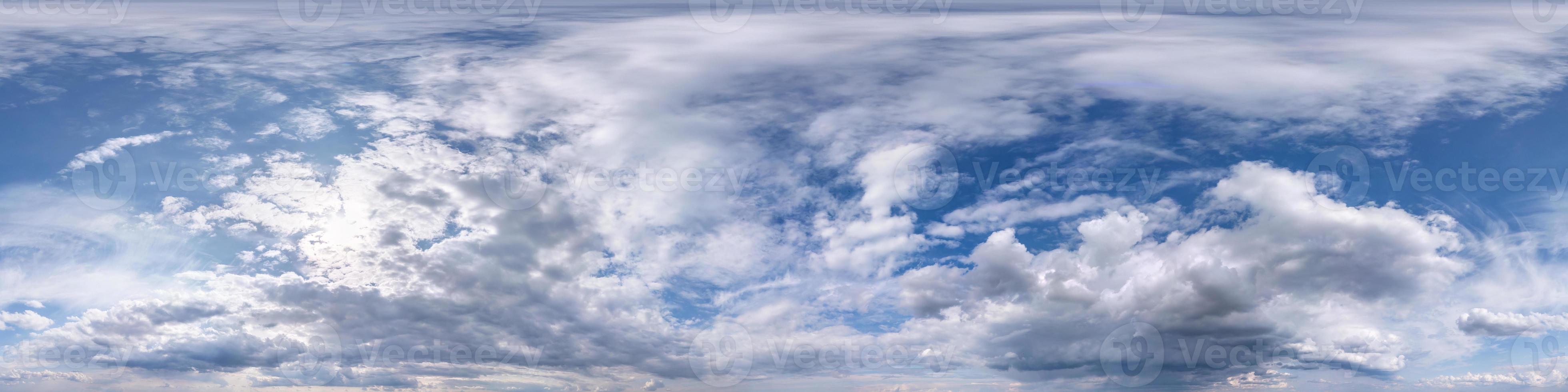 blue sky with beautiful fluffy cumulus clouds. Seamless hdri panorama 360 degrees angle view without ground for use in 3d graphics or game development as sky dome or edit drone shot photo