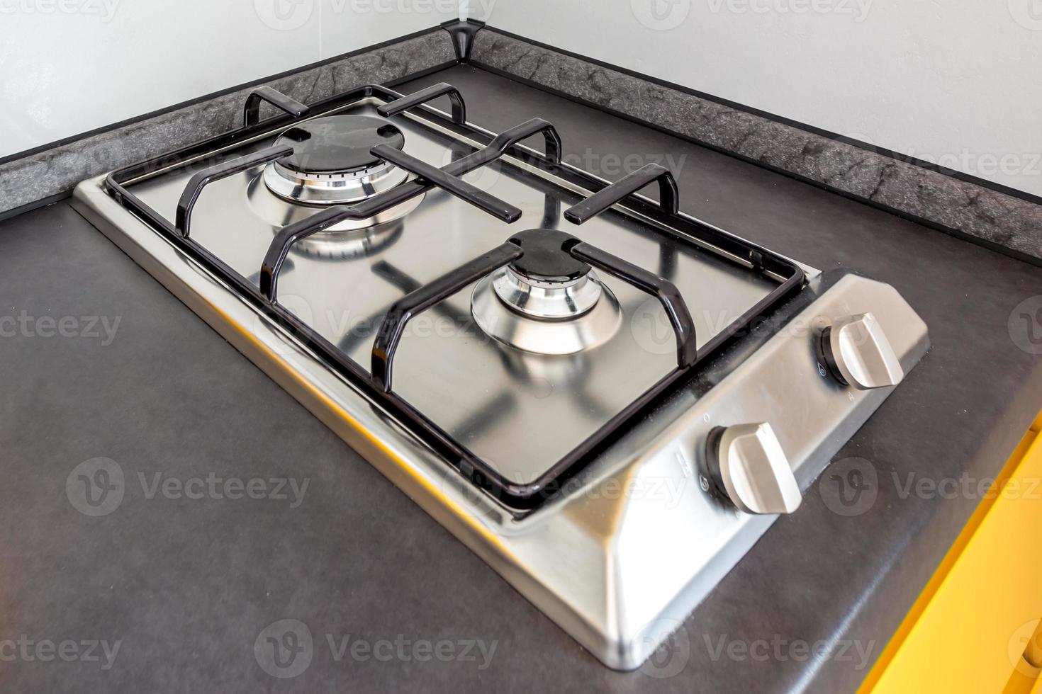 gas stove cooker on two burners in the kitchen photo