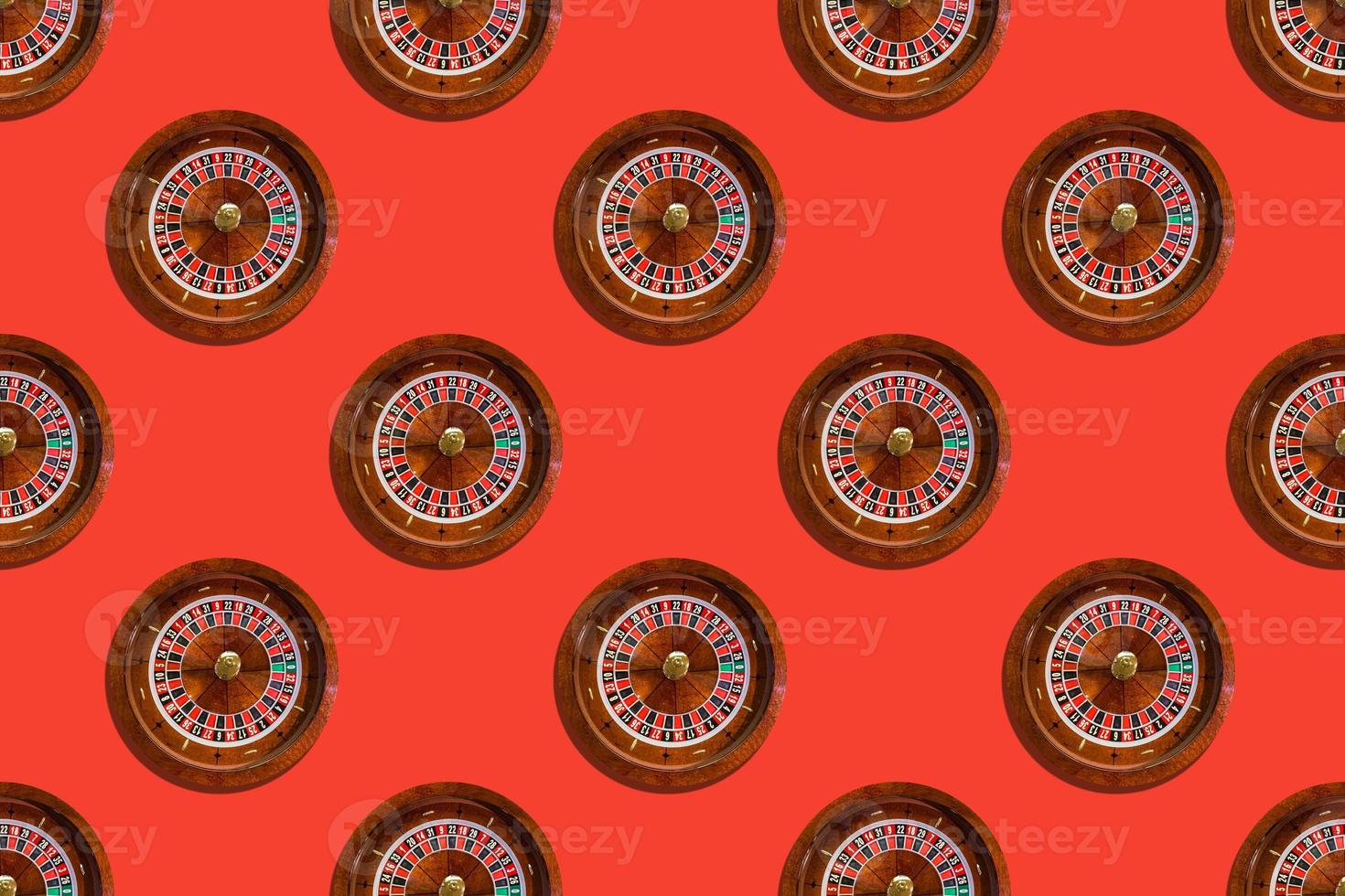 Seamless pattern of game table roulette from elite casino on red background photo