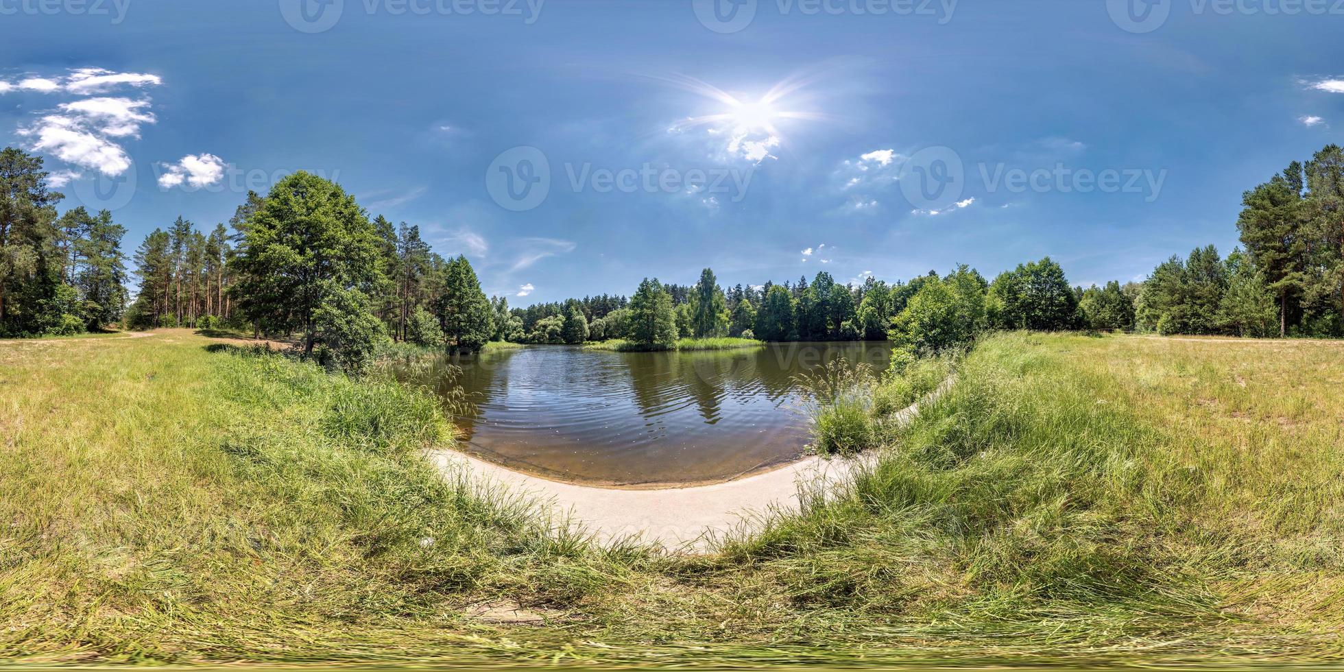 seamless spherical hdri panorama 360 degrees angle view on grass coast of small lake or river in sunny summer day and windy weather with beautiful clouds in equirectangular projection, VR content photo