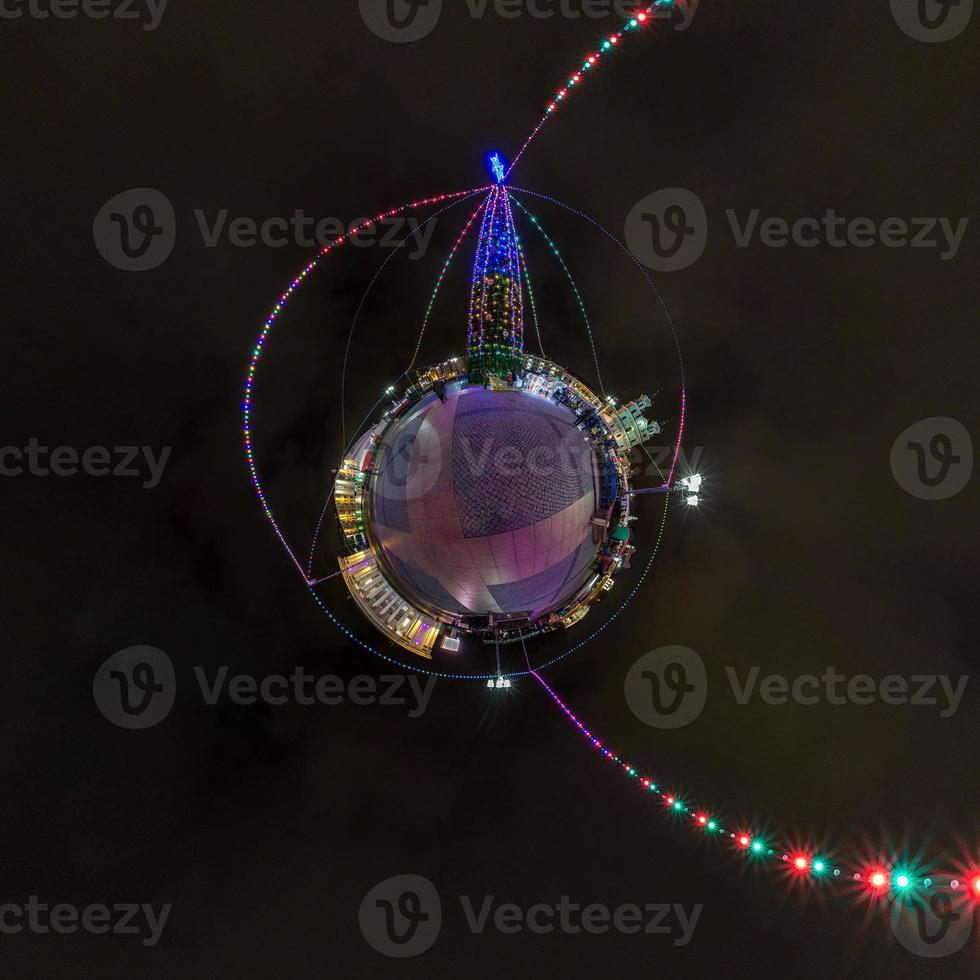 New year little planet.  Spherical aerial 360 degree panorama night view on a festive square with a Christmas tree photo