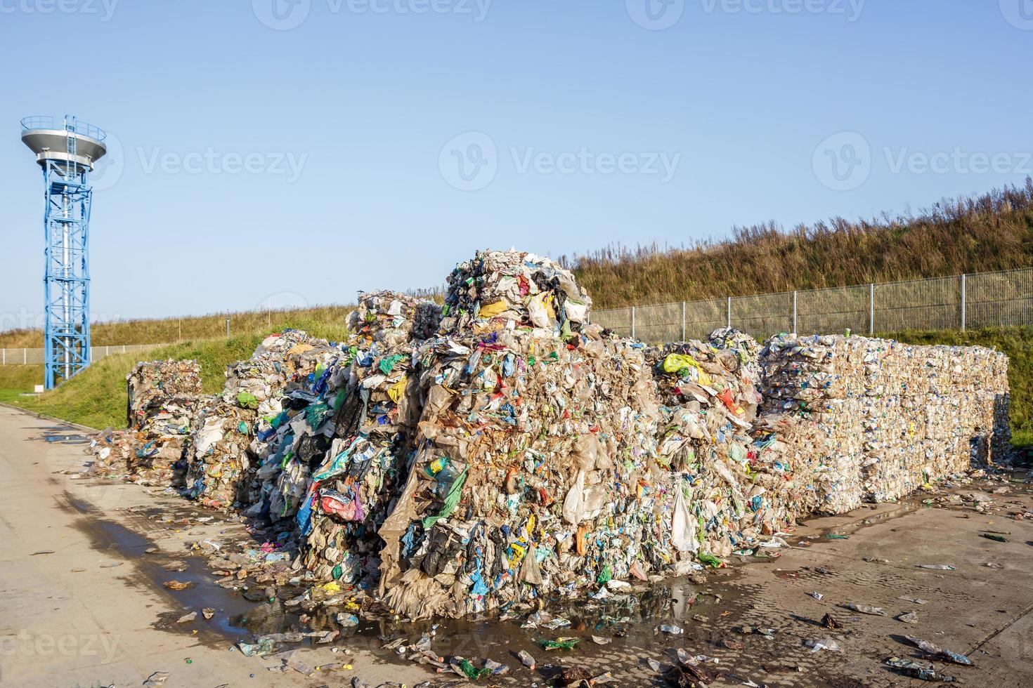 Plastic bales at the waste processing plant. Separate garbage collection. Recycling and storage of waste for further disposal. Business for sorting and processing of waste. photo