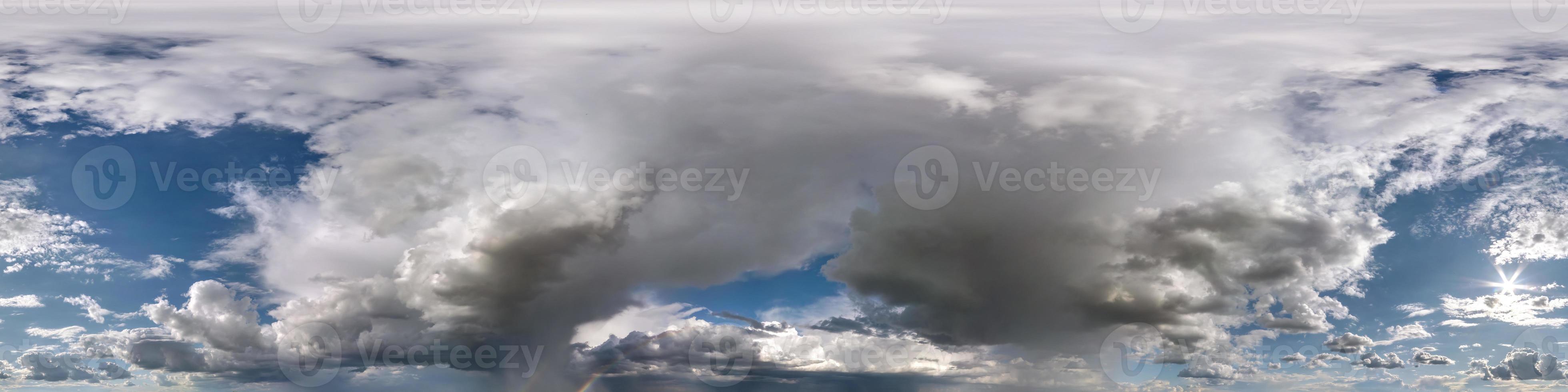 blue sky with beautiful fluffy cumulus clouds. Seamless hdri panorama 360 degrees angle view without ground for use in 3d graphics or game development as sky dome or edit drone shot photo
