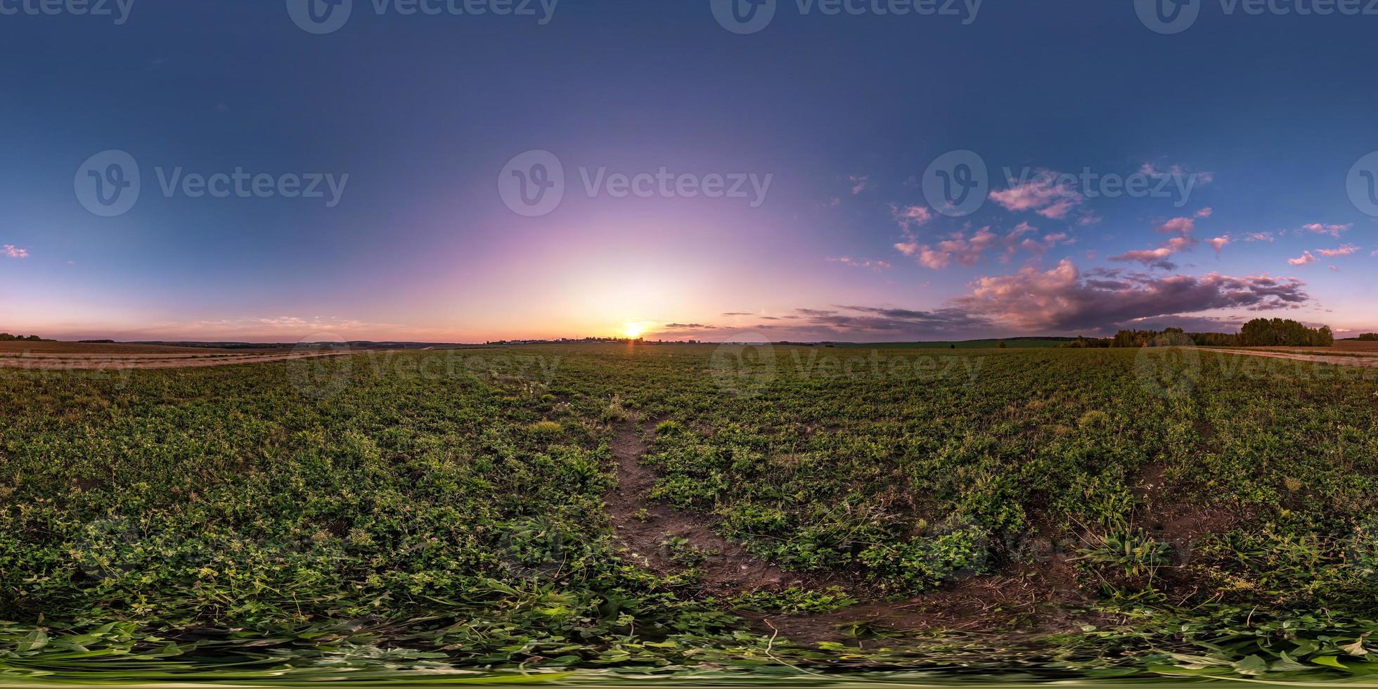 full seamless spherical hdri panorama 360 degrees angle view among fields in summer evening sunset with awesome clouds in equirectangular projection, ready for VR AR virtual reality photo