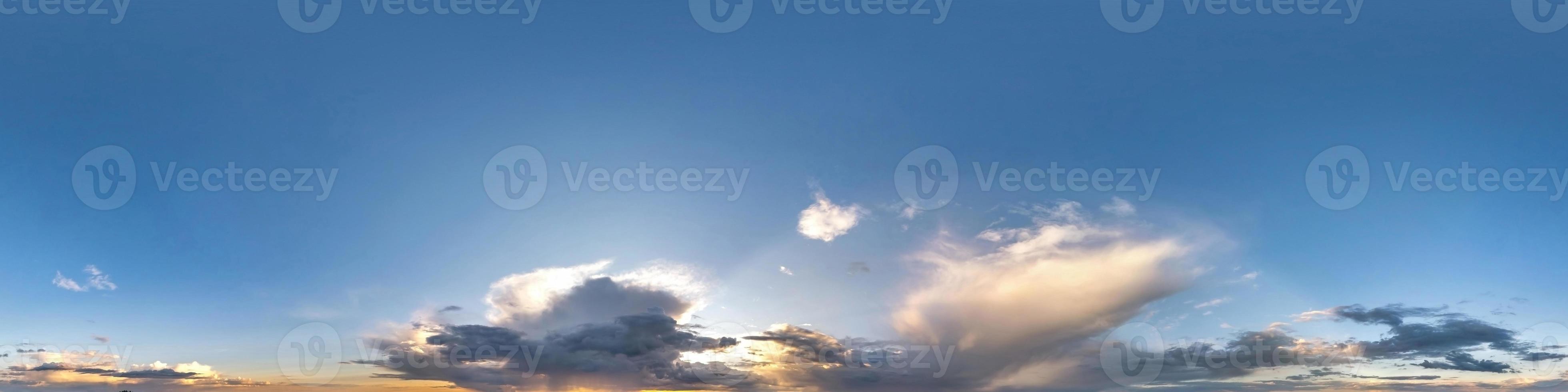 blue evening sky with beautiful fluffy clouds without ground before storm. Seamless hdri panorama 360 degrees angle view for use in 3d graphics or game development as sky dome or edit drone shot photo