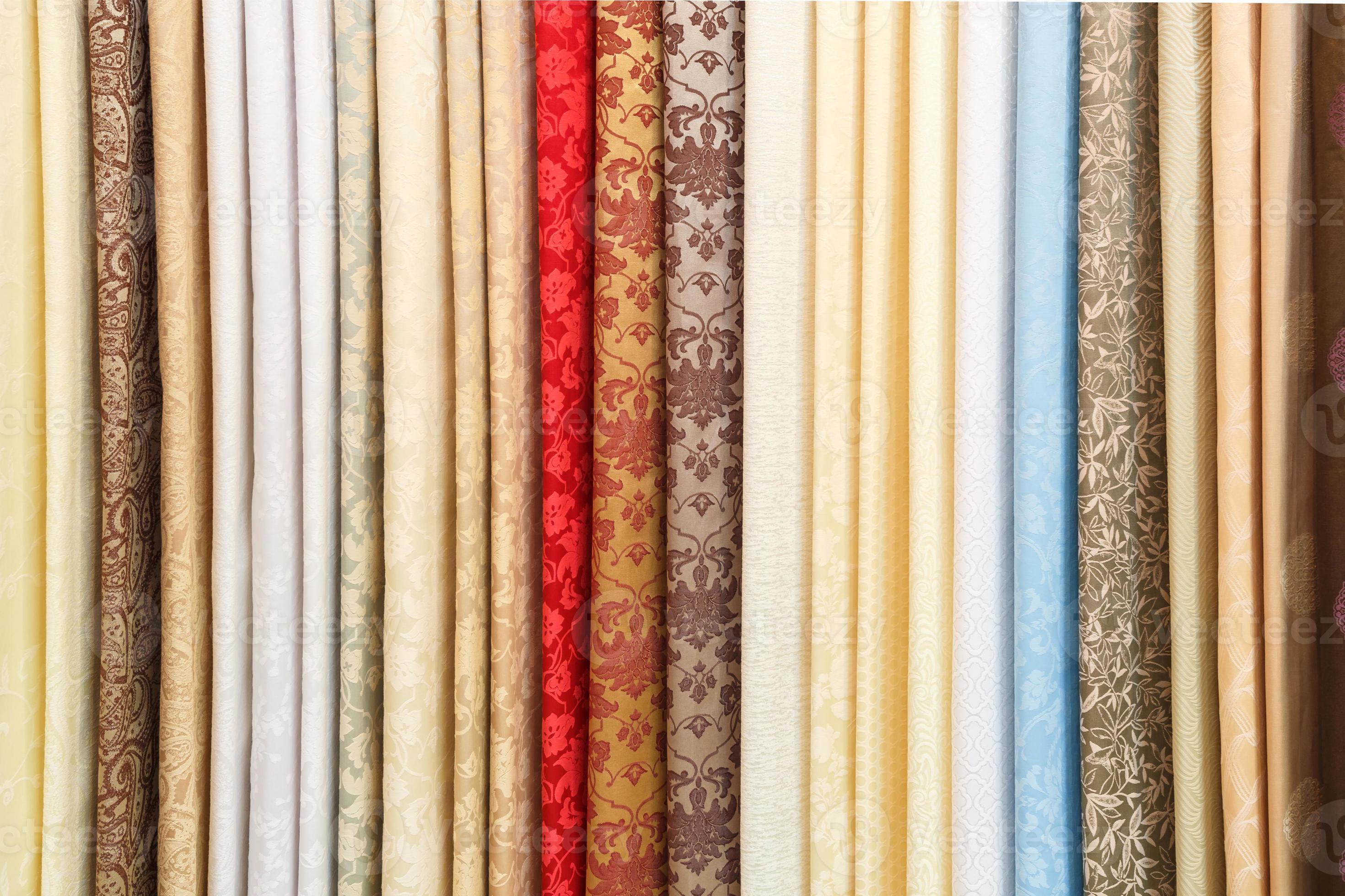 wide selection of different color textile silk fabrics clothes lay in