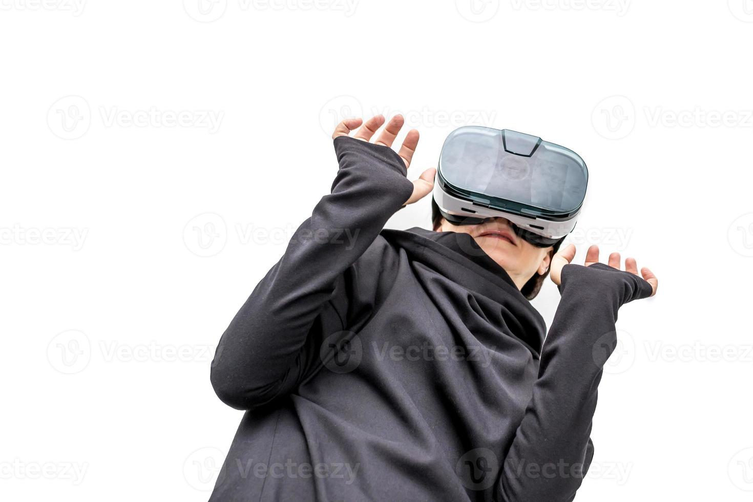 old woman in 360 view virtual reality glasses playing the game isolated on white background. 3D device gadget for watching movies for travel and entertainment in 3d space.. Cardboard VR AR glasses photo