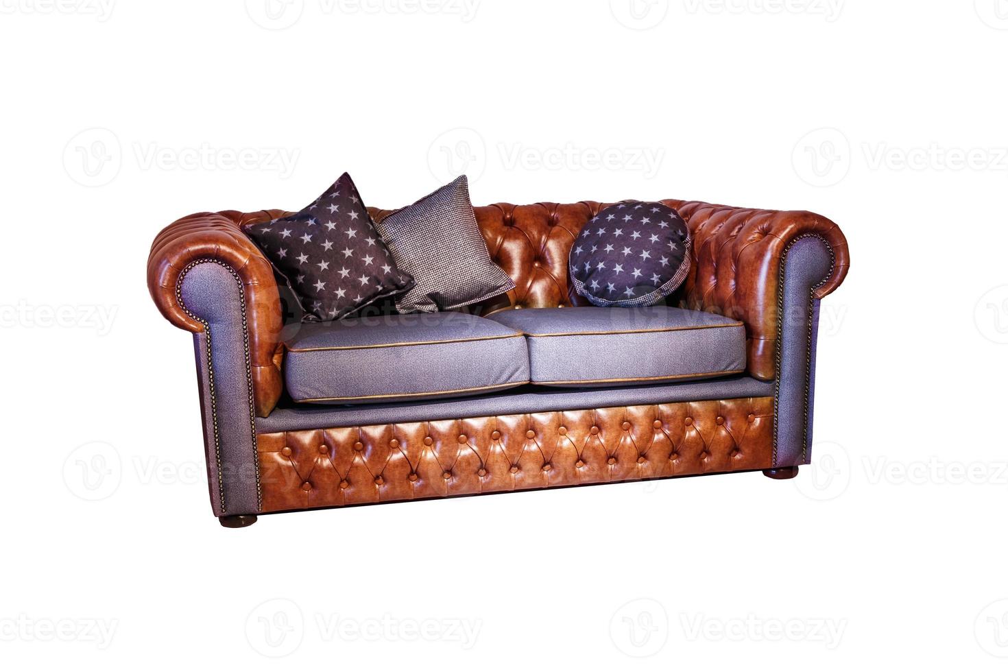 dark brown leather sofa with pillows in chester style for elite loft interior isolated white background photo