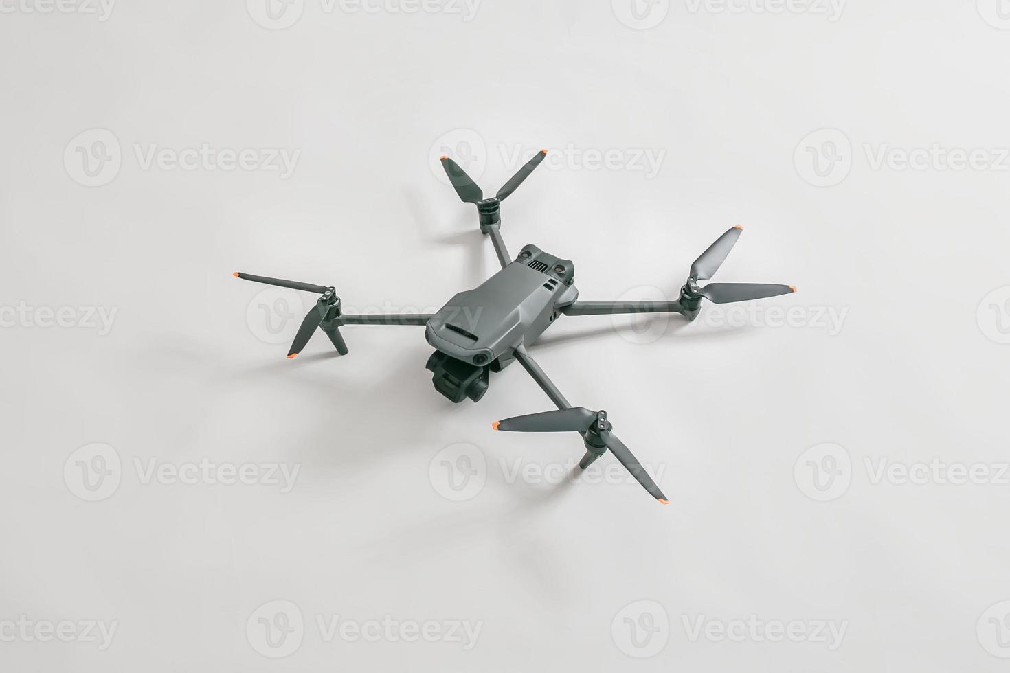 explore consumer drone with unique tele camera scout and plan your shots on gray background photo