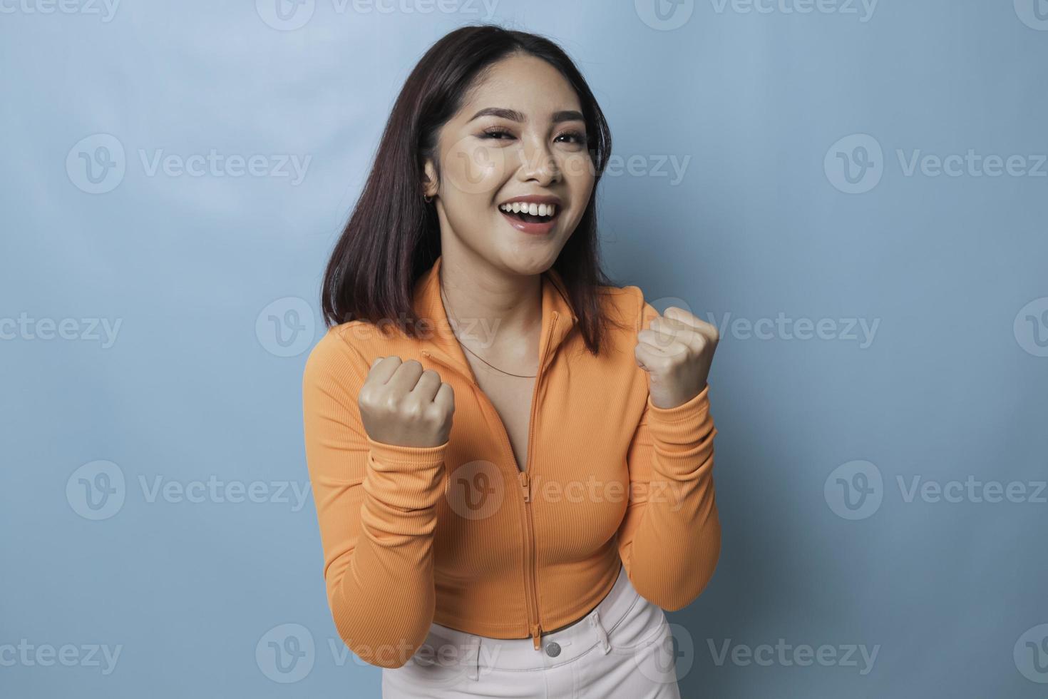 A young Asian woman with a happy successful expression photo